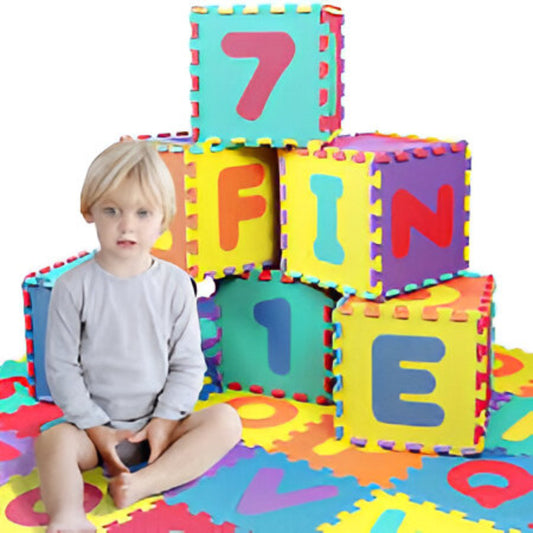 Child playing with colorful alphabet and number foam mats on a white background
for children age 3+